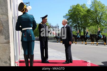 Moscow, Russia. 07th May, 2018. Russian President Vladimir Putin, left, is greeted as he arrives at the Kremlin Grand Palace to be sworn-in for the forth time as the President of the Russian Federation May 7, 2018 in Moscow, Russia. (Kremlin Pool via Credit: Planetpix/Alamy Live News Stock Photo