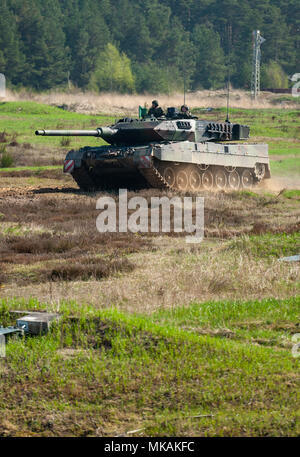 19 April 2018, Germany, Munster: A tank of the model Leopard 2 A7 drives around Bundeswehr training grounds. Photo: Philipp Schulze/dpa Stock Photo