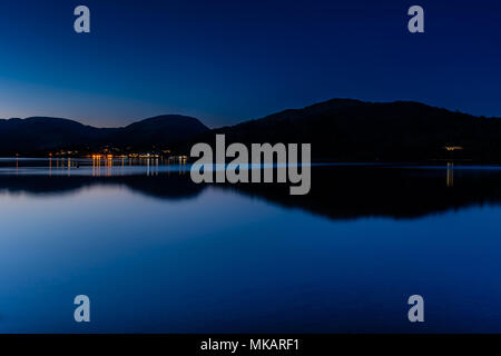 Ambleside and Waterhead reflections in Windermere, seen from near Wray Castle, Ambleside, Lake District, Cumbria Stock Photo