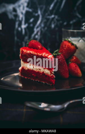 Red velvet cake in a moody image of the dessert Stock Photo