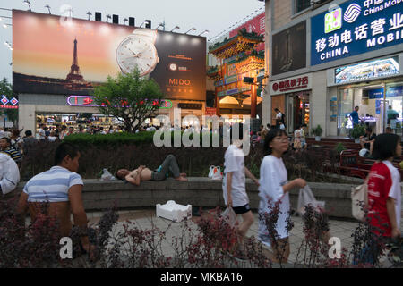 Life in Wangfujing shopping street, Dongcheng District, Beijing, China, Asia. Shopping center for tourists and residents. People walking in downtown a Stock Photo