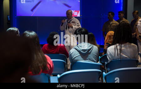 HM2 Steven Wade, a corpsman with Combat Logistics Battalion 24, speaks about his job as a corpsman to local high school juniors and seniors during a Science, Technology, Engineering and Math Presentation at the Museum of Discovery and Science as part of Fleet Week Port Everglades, Fort Lauderdale, FL, May 3, 2018. During Fleet Week, Marines and Sailors are dedicating their time to providing assistance to the community through school visits, speaking to students and paying tribute to local veterans. (U.S. Marine Corps photo by Sgt. Justin T. Updegraff) Stock Photo