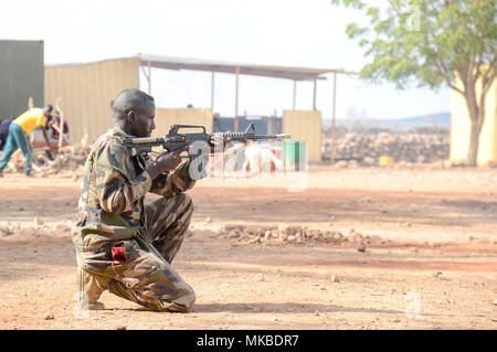 A Djiboutian soldier provides security during the culminating exercise of a five-week training cycle for the newly formed Rapid Intervention Battalion (RIB), a newly formed Djiboutian army crisis response unit, at a site outside Djibouti City, May 3, 2018.  U.S. Army Soldiers from Alpha Company, 3rd Battalion, 141st Infantry Regiment, Texas National Guard, assigned to Combined Joint Task Force- Horn of Africa conducted the RIB training. (U.S. Navy Photo by Mass Communication Specialist 2nd Class Timothy M. Ahearn)