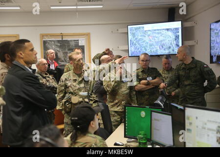 U.S. Army Col. Curtis Buzzard, Commander of the Joint Multinational  Readiness Center Operations Group, briefs distinguished visitors,  Hohenfels, Germany, May 3, 2018. Various military and civilian officials  came to Hohenfels to see