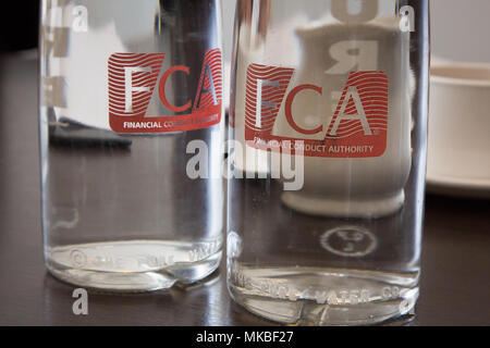 Water bottles at the Financial Conduct Authority (FCA) offices, North Colonnade, Docklands, London. Logo corporate branding is clearly displayed Stock Photo