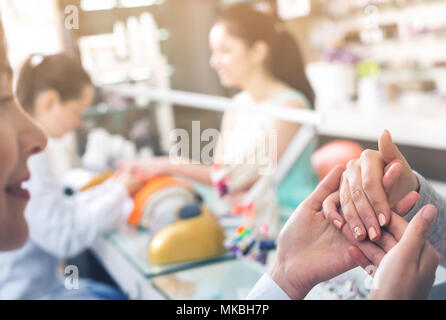 Woman hands in nail salon receiving professional manicure Stock Photo