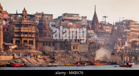 Manikarnika Ghat is one of the holiest among the sacred riverfronts, alongside the river Ganga. It is believed that a dead  soul finds salvation Stock Photo
