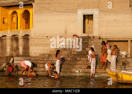 Hindus believe that to wash in the Ganges washes away all sins. Many Hindus can be seen cleansing their soul each morning at Varanasi. Stock Photo