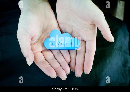 Nis, Serbia, April 24, 2018:  woman hands on black background  holding Microsoft Windows OneDrive icon Stock Photo