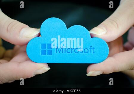 Nis, Serbia, April 24, 2018:  woman hands on black background  holding Microsoft Windows OneDrive icon Stock Photo