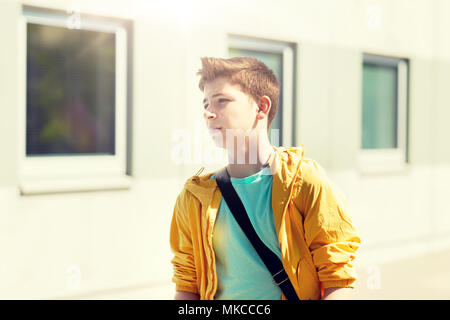 teenage student boy walking outdoors Stock Photo