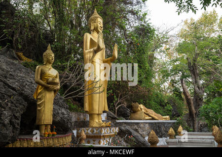 Three golden Buddha statues at the Mount Phousi (Phou Si, Phusi, Phu Si) in Luang Prabang, Laos. Stock Photo