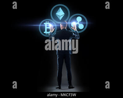 buisnessman with cryptocurrency holograms Stock Photo