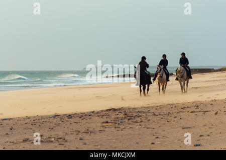 Horse riding on the beach in the south of Spain Stock Photo