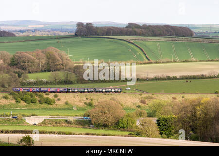 Dorchester, England, UK - April 15, 2017: A First Great Western Railway passenger train runs through the agricultural landscape of the Dorset Downs. Stock Photo