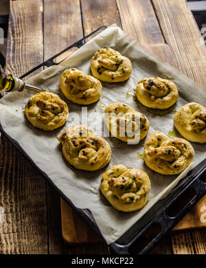 greaves with oil and spices, on a traditional wooden countertop with candle and black background, Stock Photo