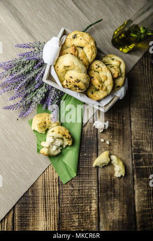 greaves with oil and spices, on a traditional wooden countertop with candle and black background, Stock Photo