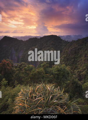 Colorful sunset over the mountains of Krabi, seen from the top of the Tiger Cave temple Stock Photo