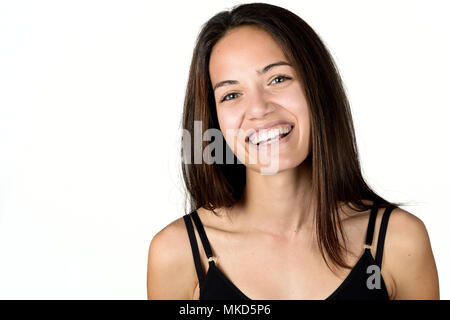 Beautiful young woman without make-up laughing. Beautiful girl with green eyes, model of fashion wearing black tank top on white background. Stock Photo