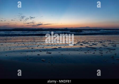 Sunrise on the beach Stock Photo