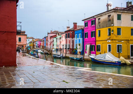 Colourful houses on a Burano street in the rain, Burano, Venice Stock Photo