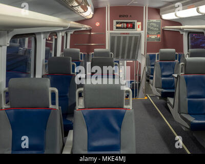 One column of seats on a commuter train ready for departure Stock Photo