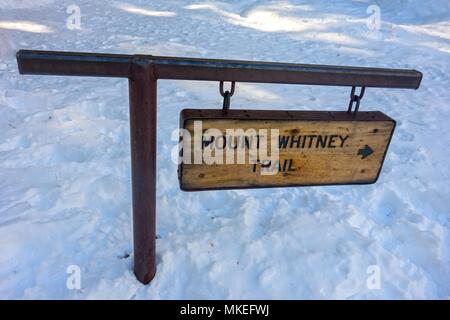 Mount Whitney Hiking Sign Table in Sierra Nevada, California almost buried by deep snow in late winter Stock Photo