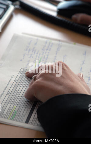 close up of mans hands on office desk Stock Photo