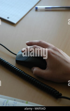 close up of mans hands on office desk Stock Photo