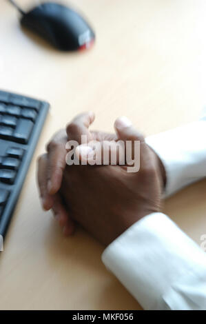 close up of mans hands on office desk Stock Photo