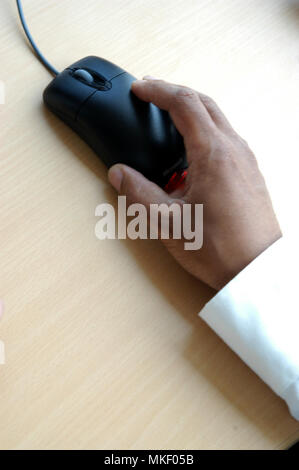 close up of mans hands on office desk Stock Photo