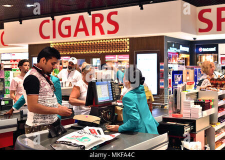 Dubai, UAE - April 10. 2018. The buyer at checkout in duty free shop at the airport Stock Photo