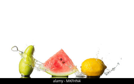 Fresh fruits splash. Pear, watermalon and lemon with water wave isolated on white background. Stock Photo