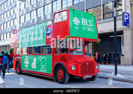 A Routemaster red double decker bus in Montreal in the St Patrick's Day parade Stock Photo