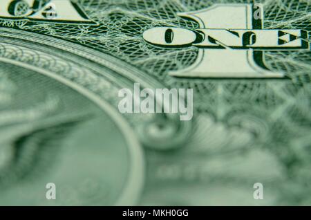 Shallow focus on ONE from the American dollar bill. Stock Photo