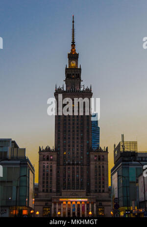 Palace of Culture and Science, the tallest building in Warsaw, Poland. Gift from the Soviet Union to the people of Poland during the end of a sunset. Stock Photo