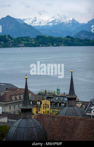 Overhead view of Lucerne overlooking the river Reuss and snow covered mountains, Luzern, Switzerland, Europe Stock Photo