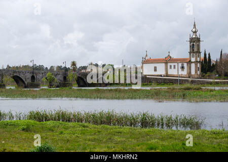 Igreja de Santo António da Torre Velha catholic church next to the medieval bridge over the Lima river in Ponte de Lima, Portugal, Europe Stock Photo