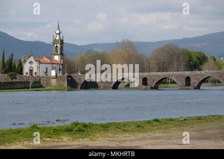 Igreja de Santo António da Torre Velha catholic church next to the medieval bridge over the Lima river in Ponte de Lima, Portugal, Europe Stock Photo