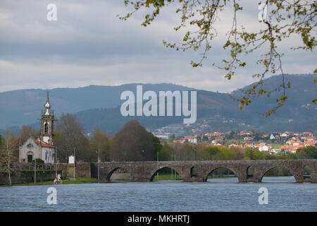 Igreja de Santo António da Torre Velha catholic church next to the medieval bridge over the Lima river in Ponte de Lima, Portugal, Europe Stock Photo