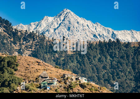 A distant view of Dhauladhar Mountain ranges during a sunny day. Triund, Dharamshala, Himachal Pradesh. India Stock Photo