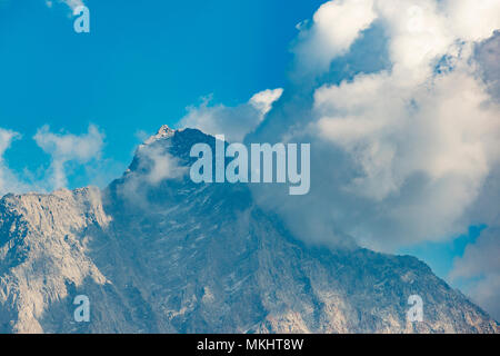A beautiful view of Dhauladhar Mountain ranges during a sunny day and some clouds. Triund, Himachal Pradesh. India