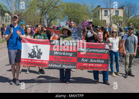 MINNEAPOLIS - May 6, 2018: Individuals proteting police brutality march in Minneapolis’ yearly May Day parade. Stock Photo
