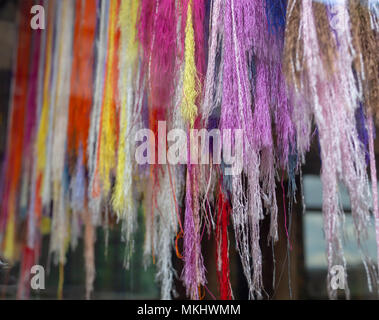 Multicolored Embroidery Thread Yarns, Colorful Fabric material Stock Photo