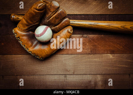 Vintage baseball gear on a wooden background Stock Photo