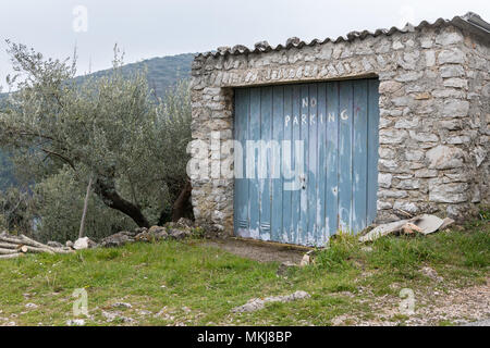 Old garage made of stone with No Parking written on door, Croatia (Island Cres) Stock Photo