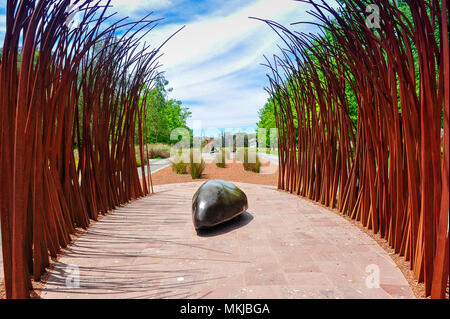 'Fire & Water' Sculpture, Reconciliation Place. The monument is a symbolic sensory journey from hearth to gathering stone, red representing the land Stock Photo