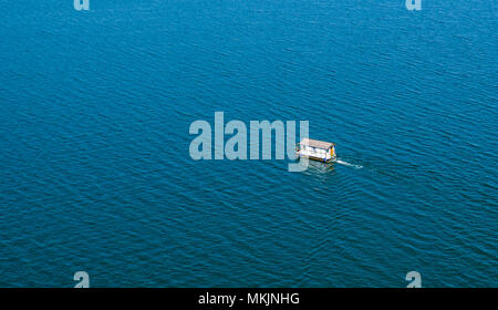 08 May 2018, Germany, Muecheln: A houseboat sailing on the Geiseltalsee lake (aerial shot taken with a drone). The lake born out of aformer lignite pit is the largest artificial lake in Germany with its almost 19 square kilometers of surface. Photo: Jan Woitas/dpa-Zentralbild/dpa Stock Photo