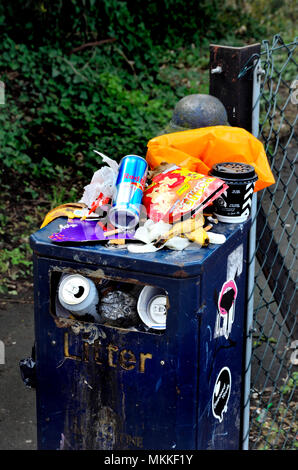 Overflowing litter bin in Maidstone, Kent, England, UK. Stock Photo