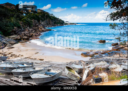 One of the stunning bays along the famous Coogee to Bondi Beach walk. This bay has small boats and dinghies dragged up on the beach. Sydney New South Stock Photo